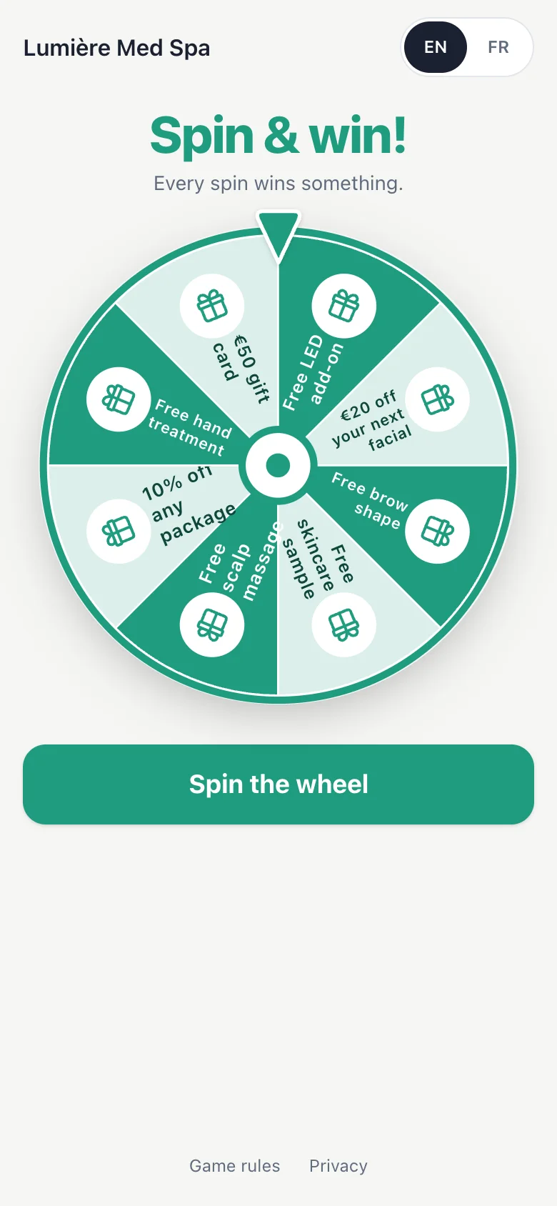 Spin on a phone. The prize wheel for Lumière Med Spa, with prizes like a free LED add-on and €20 off your next facial.